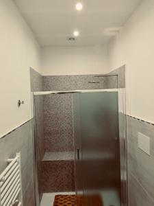a shower with a glass door in a bathroom at Casa Francesca in Mercato San Severino +13 photos
