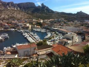a view of a harbor with boats in the water at Cabanon aux Goudes Marseille calanques in Marseille