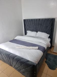 Ένα ή περισσότερα κρεβάτια σε δωμάτιο στο 1 bedroom TRM drive Roysambu Thika road