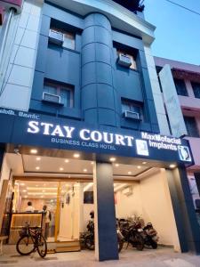 a building with motorcycles parked in front of it at Stay Court - Business Class Hotel - Near Central Railway Station in Chennai