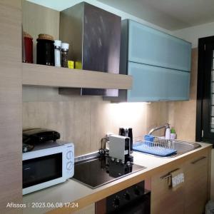 A kitchen or kitchenette at Villas On The Rock Afissos