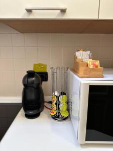 A kitchen or kitchenette at Vittoria Apartment
