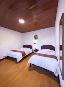 Voodi või voodid majutusasutuse Hotel Cusco Plaza Saphi toas
