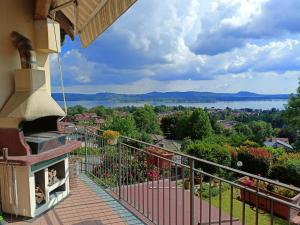 a balcony with a view of a lake at Tramonto al Lago in Gavirate