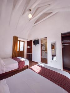 Voodi või voodid majutusasutuse Hotel Cusco Plaza Saphi toas