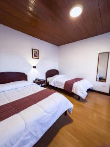 Voodi või voodid majutusasutuse Hotel Cusco Plaza Saphi toas