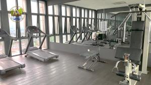 a gym with a bunch of exercise equipment in it at Revo-Pavilion-Bukit Jalil in Kuala Lumpur