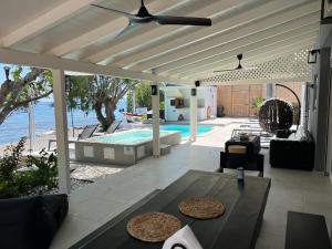 a living room with a patio with a pool at Nikkon Luxury Living in Arvi