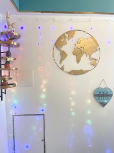 a room with a globe on the wall with lights at Oliveri - camera con ingresso Indipendente in Oliveri