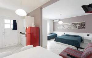 Postel nebo postele na pokoji v ubytování Hotel & Residence Progresso