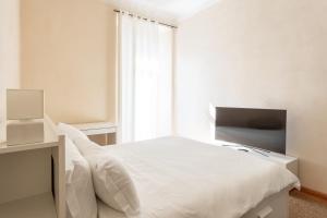Voodi või voodid majutusasutuse Suite Cavour by iCasamia it toas