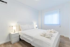 Postel nebo postele na pokoji v ubytování Pedrera 1 Tarragonastay