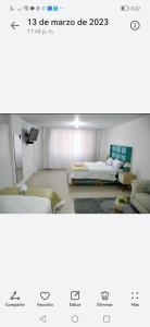 sala de estar con 2 camas y sofá en Hospedaje La Melit en Tacna