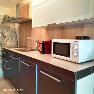 A kitchen or kitchenette at Villas On The Rock Afissos