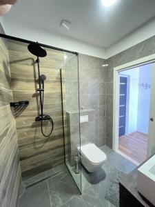 a bathroom with a shower and a toilet at Calypso in Trogir +25 photos