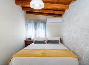 Postel nebo postele na pokoji v ubytování Villa Erato-Stalis