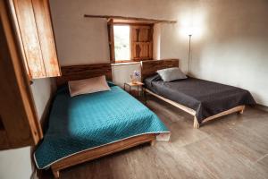 Cama o camas de una habitación en Casa Primitivo