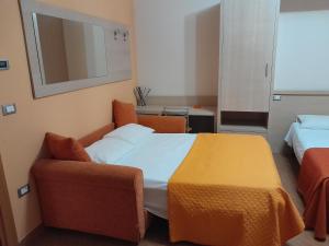a hotel room with a bed and a chair at Affittacamere Certe Notti in Sala Consilina
