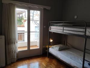 Postel nebo postele na pokoji v ubytování Άνετο στυλάτο σπίτι στο Μικρολίμανο του Πειραιά