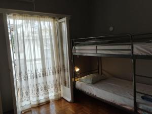Postel nebo postele na pokoji v ubytování Άνετο στυλάτο σπίτι στο Μικρολίμανο του Πειραιά