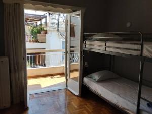 Postel nebo postele na pokoji v ubytování Άνετο στυλάτο σπίτι στο Μικρολίμανο του Πειραιά