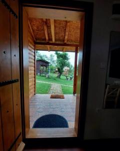a view from the inside of a door looking out at a yard at Palanačka Avlija 2 in Ripanj