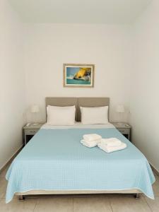 Cama ou camas em um quarto em Villa Oceania