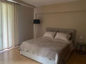 Ένα ή περισσότερα κρεβάτια σε δωμάτιο στο Apartament in center Tirane