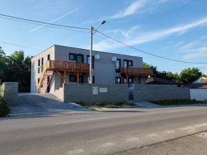 a building on the side of a road at GRAND HYATT APPARTMENTS in Podhájska