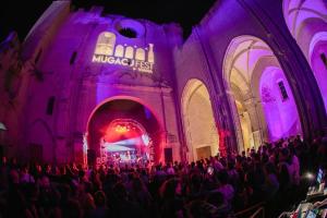 a large group of people in a building with purple lights at Apartamento Turístico VIANA II in Viana