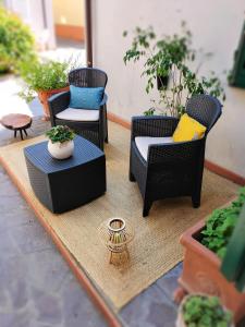 a group of chairs and a table on a patio at Loft 21 in Empoli