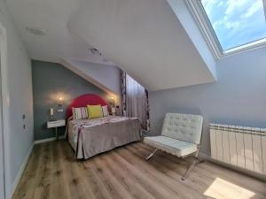 Postel nebo postele na pokoji v ubytování Hostal Sainz