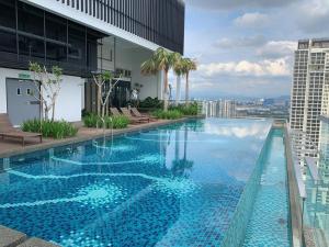 a large swimming pool on top of a building at Revo-Pavilion-Bukit Jalil in Kuala Lumpur