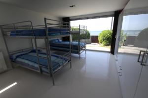 Łóżko lub łóżka w pokoju w obiekcie Casa en el Atlantico, Villa encima del Mar, A Guarda, Rias Bajas