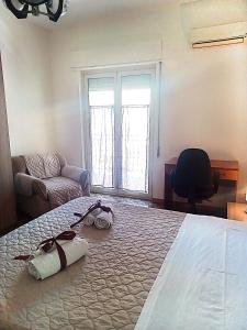 a bedroom with a bed with two bags on it at Casa al centro in Palermo