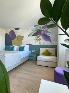 a bedroom with a bed and a couch at Villa Ardura - island holiday residence **** Bol. Island Brač in Bol
