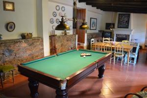 a living room with a pool table in it at Monte do Rei Santo in Arronches