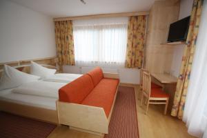 Łóżko lub łóżka w pokoju w obiekcie Hotel Garni Haus Anita