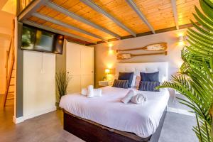 Posteľ alebo postele v izbe v ubytovaní OleHolidays 406 Loft Romana Playa junto al mar