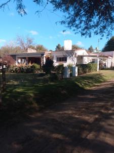 a house on the side of a road at Villa Coca -Los Jilgueros- in La Bolsa