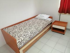 A bed or beds in a room at Restoran Filipovic