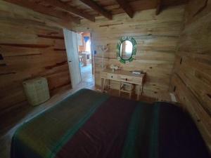 Postel nebo postele na pokoji v ubytování Cabaña Los Nogales