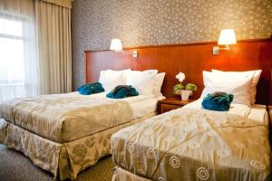 Łóżko lub łóżka w pokoju w obiekcie Hotel&Spa Stary Dziwnów