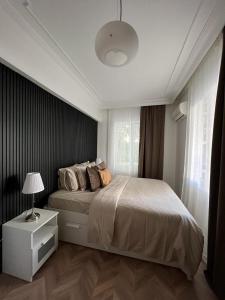 Postel nebo postele na pokoji v ubytování Квартира для семьи из 3х человек