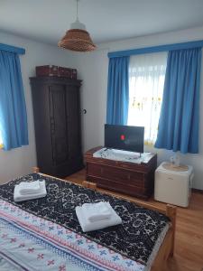 Postel nebo postele na pokoji v ubytování Casa Traditionala Clisciova