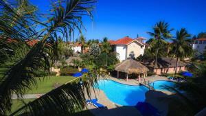 an aerial view of a resort with a swimming pool at Ocean Dream Beachfront Studio with Balcony in Cabarete