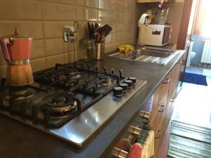 a kitchen with a stove top oven in a kitchen at CASA PANIERI in Rome