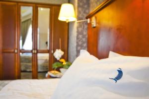 Postel nebo postele na pokoji v ubytování Hotel&Spa Stary Dziwnów basen swimming pool