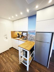 Kuchyň nebo kuchyňský kout v ubytování Apartments Monika & Breakfast Baskets 236