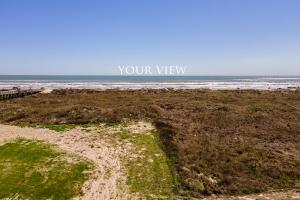a dirt road leading to the beach with the words your view at Luxury house with wet bar, outdoor shower, steps from Gulf in Port Aransas